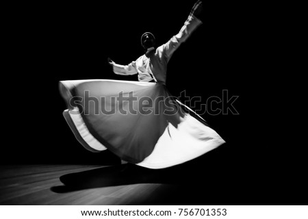 the image of a whirling Dervish in the darkness Royalty-Free Stock Photo #756701353