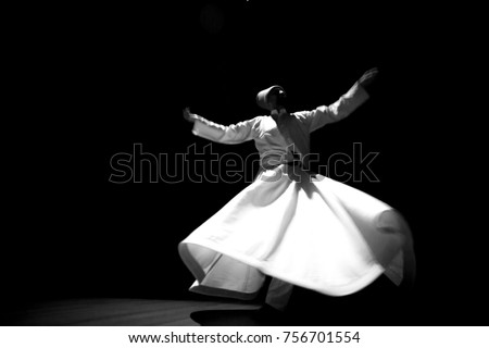 the image of a whirling Dervish in the darkness Royalty-Free Stock Photo #756701554