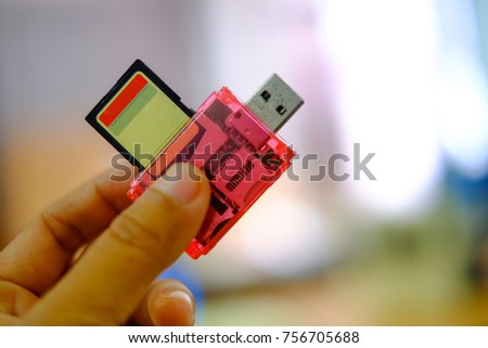 USB Connectivity, Reader for standard SD memory cards , Close up hands with pink multi card reader