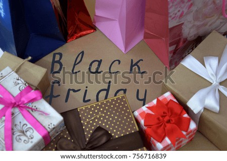 Black Friday handwritten , sales concept. shopping. boxes with gifts. shopping bags