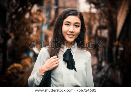 Beautiful japanese girl walking in Tokyo. Concept about teenagers and school