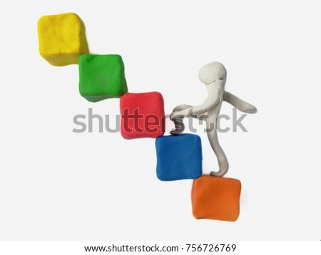 Plasticine clay squares are stacked a staircase and there are people stepping up on a white background,like a beginner business,Stepping things in order to reach the goal,This may take a short or long