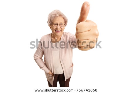 Elderly woman making a thumb up sign and smiling isolated on white background