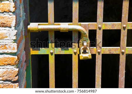 Metal gate closed with metal pole - concept image