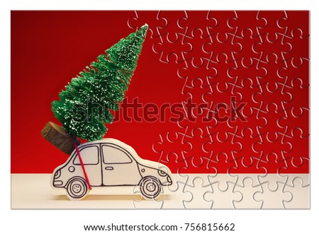 Hurry up! Christmas is coming! Holiday concept with a small pine tree on handmade cartoon toy car in jigsaw puzzle shape