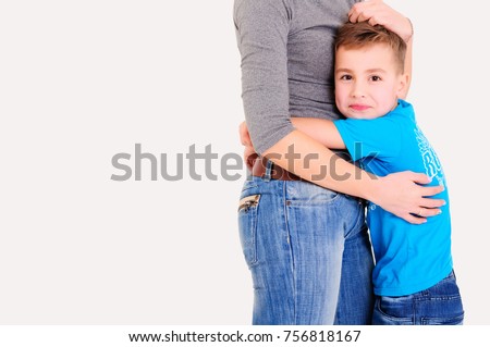 Smiling boy hugging woman torso. Conc: necessary support and protection. 
