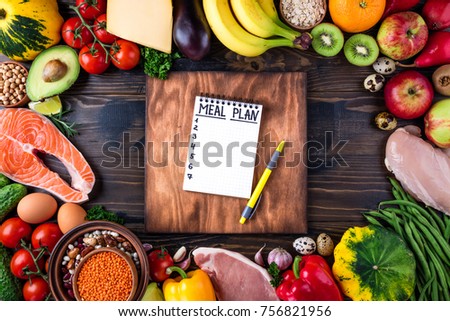 Healthy food concept. Fresh  vegetables, fruits, meat and fish on wooden table. Healthy eating and meal plan. Top view Royalty-Free Stock Photo #756821956