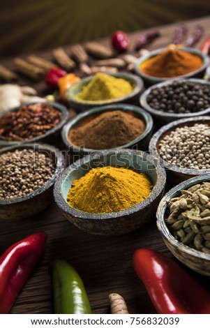 Spices and herbs in wooden bowls. Food and cuisine ingredients