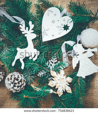 Christmas background with white toys and christmas tree. Winter postcard. Christmas composition with  fir branches. 