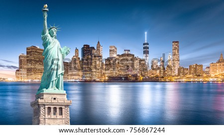 The Statue of Liberty with Lower Manhattan background in the evening, Landmarks of New York City, USA