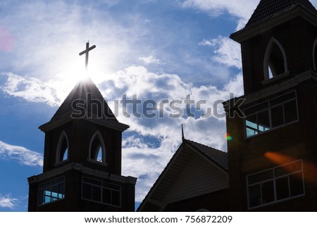 Christian church silhouetted light flare beautiful cloud