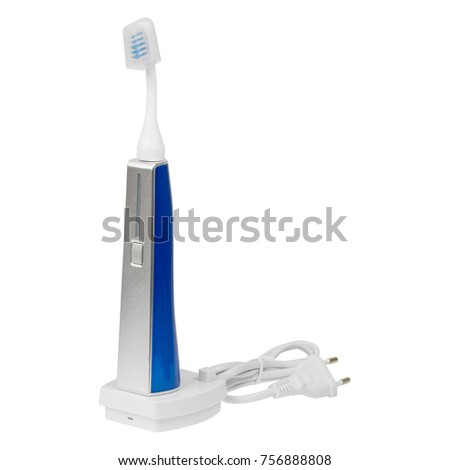 Electronic ultrasonic toothbrush on a charge stand isolated on a white background