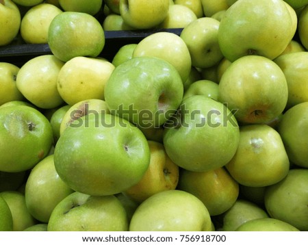 Bunch of green apples in supermarket.