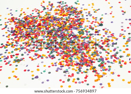 Colorful confetti over white background. Christmas or birthday concept