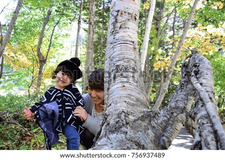 young japanese mother is playing with her son