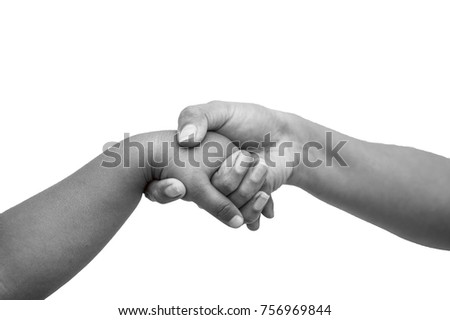 Picture of a hand holding a child's hand in black and white.