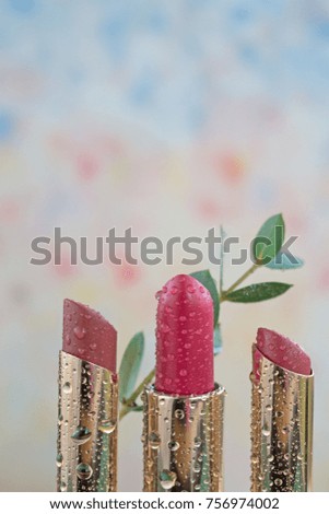 Closeup of three pink lipsticks - the concept of green beauty product  