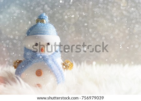 Happy snowman standing in winter christmas snow background. Merry christmas and happy new year greeting card with copy-space. Christmas celebration holiday background.