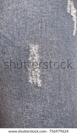 Close up to blue jeans texture.