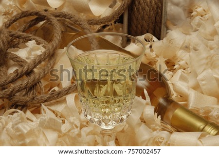 light wine on wood shavings on a light background