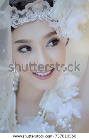 A portrait of a beautiful asian woman smiling brightly at the camera,beautiful happy Asian girl smile and laugh together.