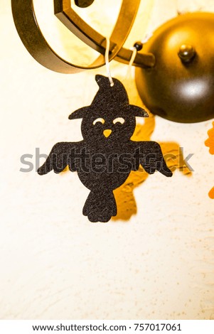 Halloween decoration on the wall ,pumpkin , ghost ,black ,funny ,bird bat ,scary ,small ,white ,background ,interior ,ornament ,decor ,flying ,hanged ,night ,light