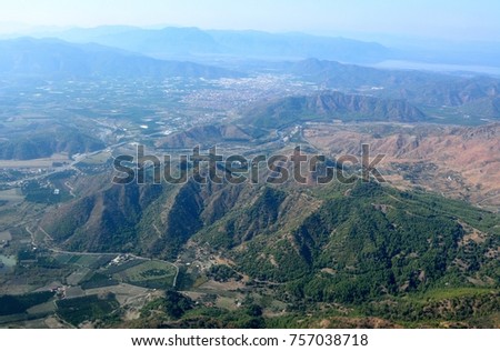 Aerial view over mountains north of Dalaman in Turkey, and all the way to Koycegiz lake in the distance. 