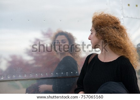 woman taking a passing look at reflection in side of American style diner like a huge mirror
 Royalty-Free Stock Photo #757065160