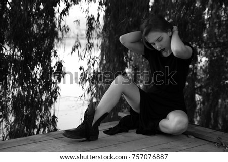 Outdoor portrait of a sad teenage girl looking thoughtful about the problems, the concept of sadness, loneliness