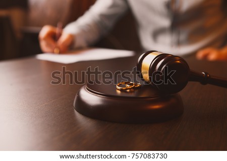 Judge gavel deciding on marriage divorce Royalty-Free Stock Photo #757083730