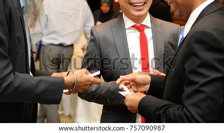 Close up shot of the business mens talking and changing business card.Speed Networking concept.