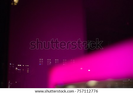 neon magenta displays on a november night in a south german city near munich and stuttgart