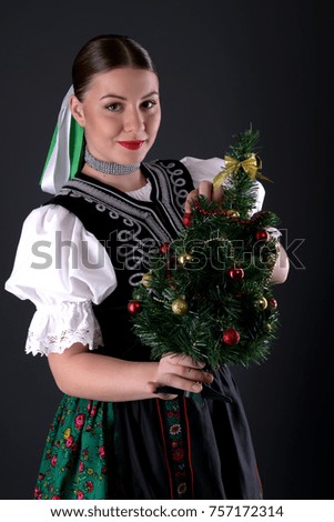 slovakian folklore dancer with christmas tree