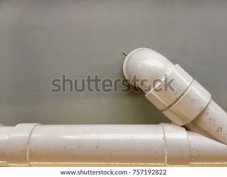 White pipes on gray walls
