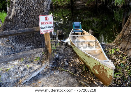 Canoe Nest To A No Trespassing sign