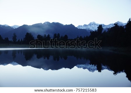 Perect reflection of Mount Cook and Mt. Tasman in Lake Matheson, Fox Glacier, South island, New Zealand