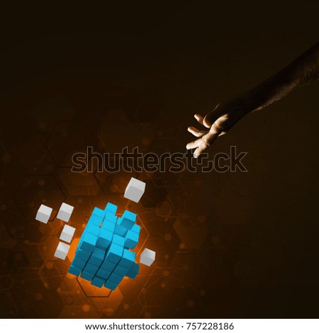 Close of man hand holding cube figure as symbol of innovation. Mixed media.