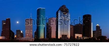 Blue Houston skyline with rising moon
