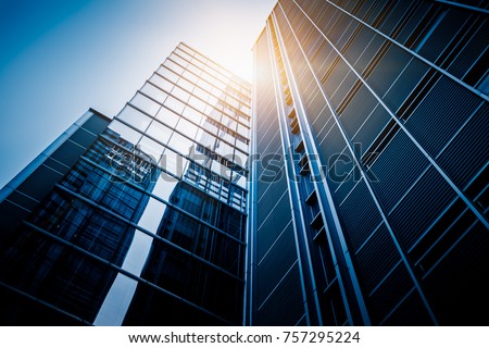 Bottom view of modern skyscrapers in business district against blue sky
 Royalty-Free Stock Photo #757295224