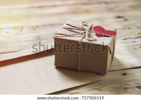 Envelope and gift box are packed in kraft paper.
