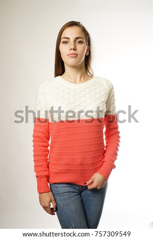 beautiful girl in a bright sweater on a white background