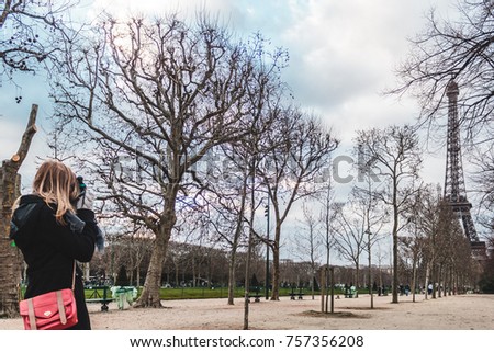 Photo of Girl Taking Pictures of Eiffel Tower in Paris, France