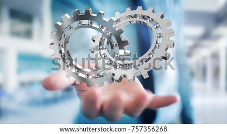 Businessman on blurred background using floating gear icons 3D rendering