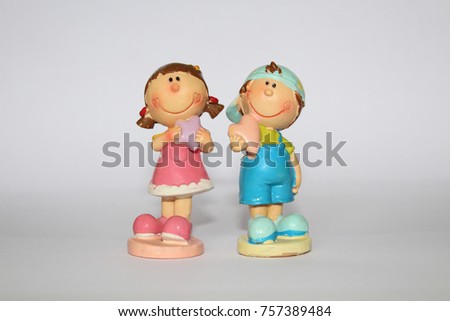 Toy figures of a boy and a girl. Valentine's Day. Isolated object on a white background. Isolate.