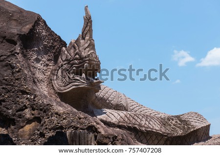 Thai dragon or Naga statue with sky , at Sakonnakhon Province, Thailand