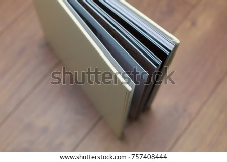 photo book with a hard cover on a wooden surface
  photo album with leatherette 