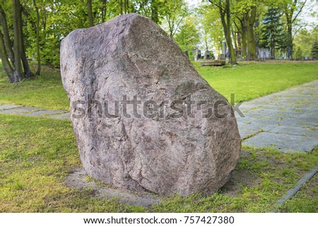 Great rock planted in the garden. Royalty-Free Stock Photo #757427380