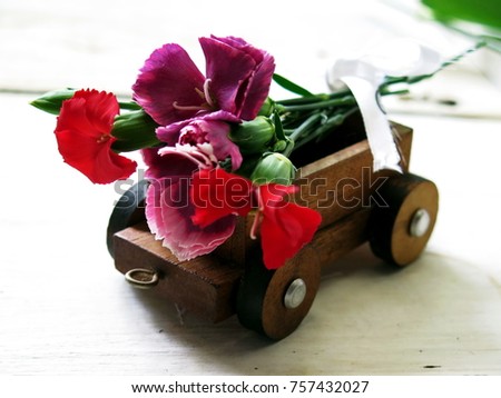 Little Wood Truck carriage bouquet  send to customer, delivery concept anniversary, Valentine's day or wedding concept, copy space   