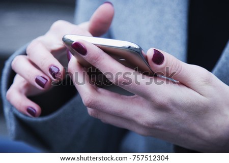 Social Media addiction. young beautiful woman holding a smartphone (psychological problems, media mania)
