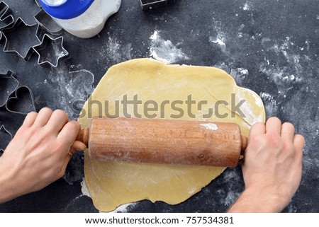 roll out dough for Christmas gingerbread cookies